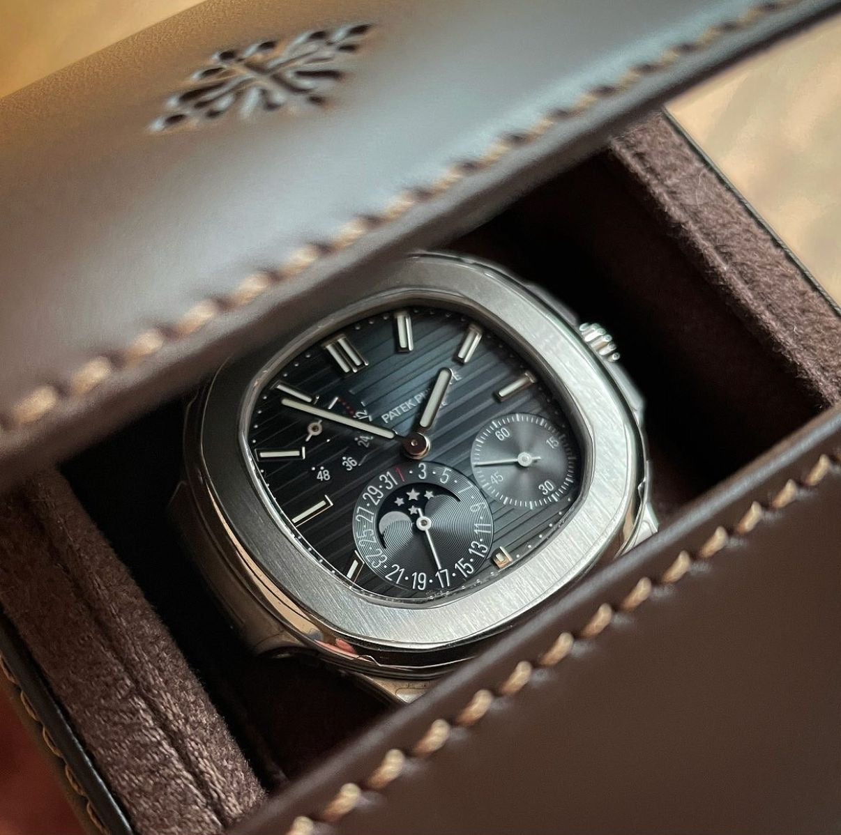 Patek Philippe Nautilus 2017 Ref. 5712/1A-001 - Official Service Papers from 2020 Regal - Hatton Garden Jewellers