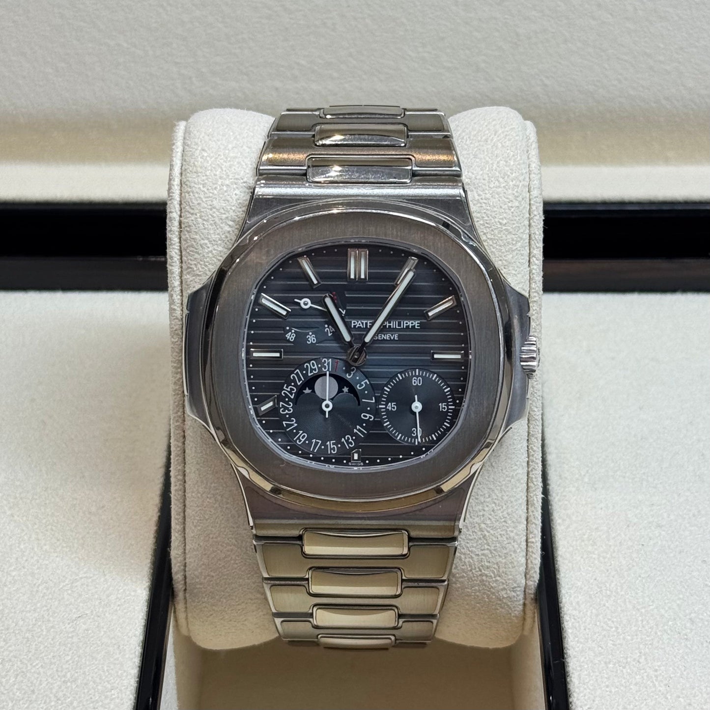 Patek Philippe Nautilus 2017 Ref. 5712/1A-001 - Official Service Papers from 2020 Regal - Hatton Garden Jewellers