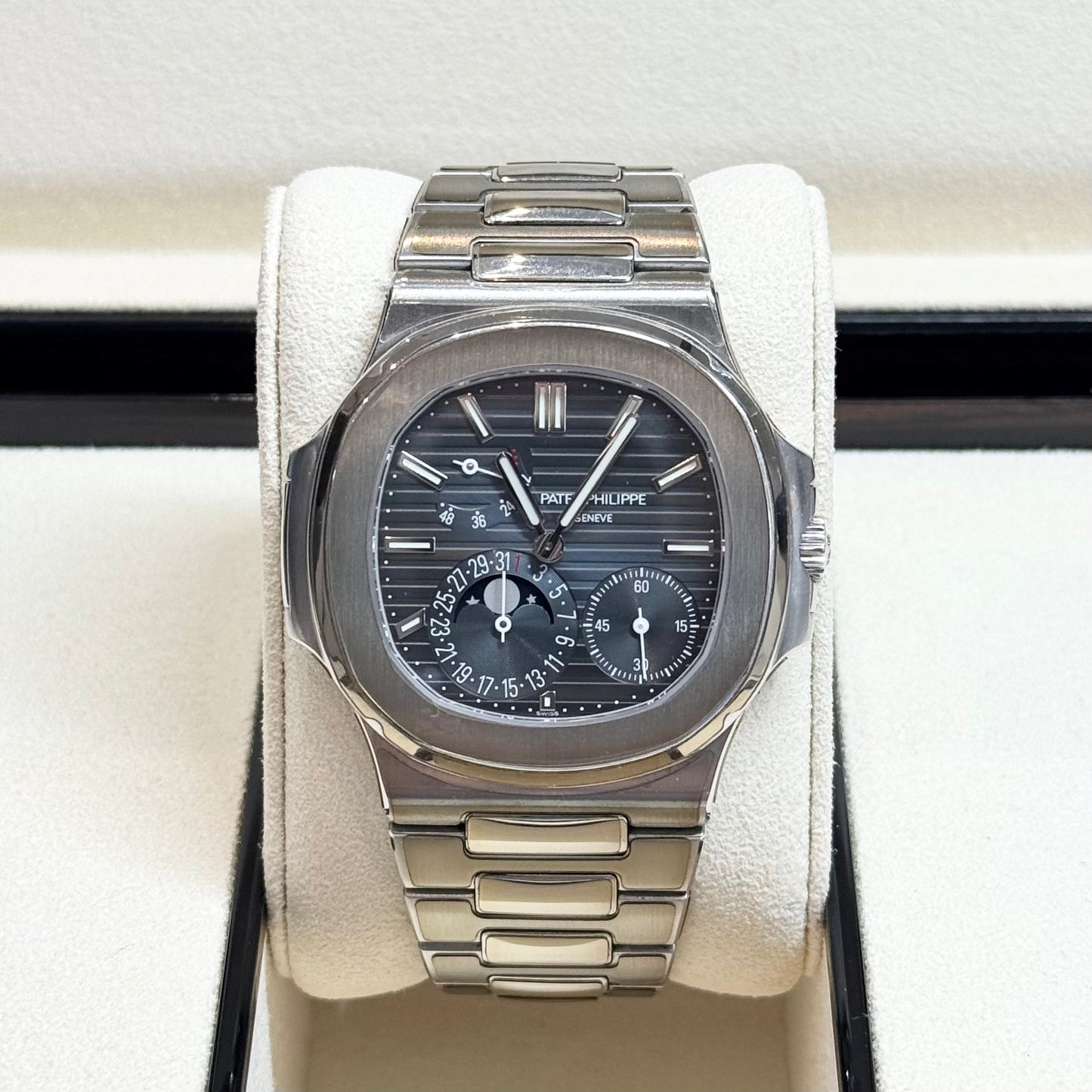 Patek Philippe Nautilus 2017 Ref. 5712/1A-001 - Official Service Papers from 2020 Regal - Hatton Garden Jewellers