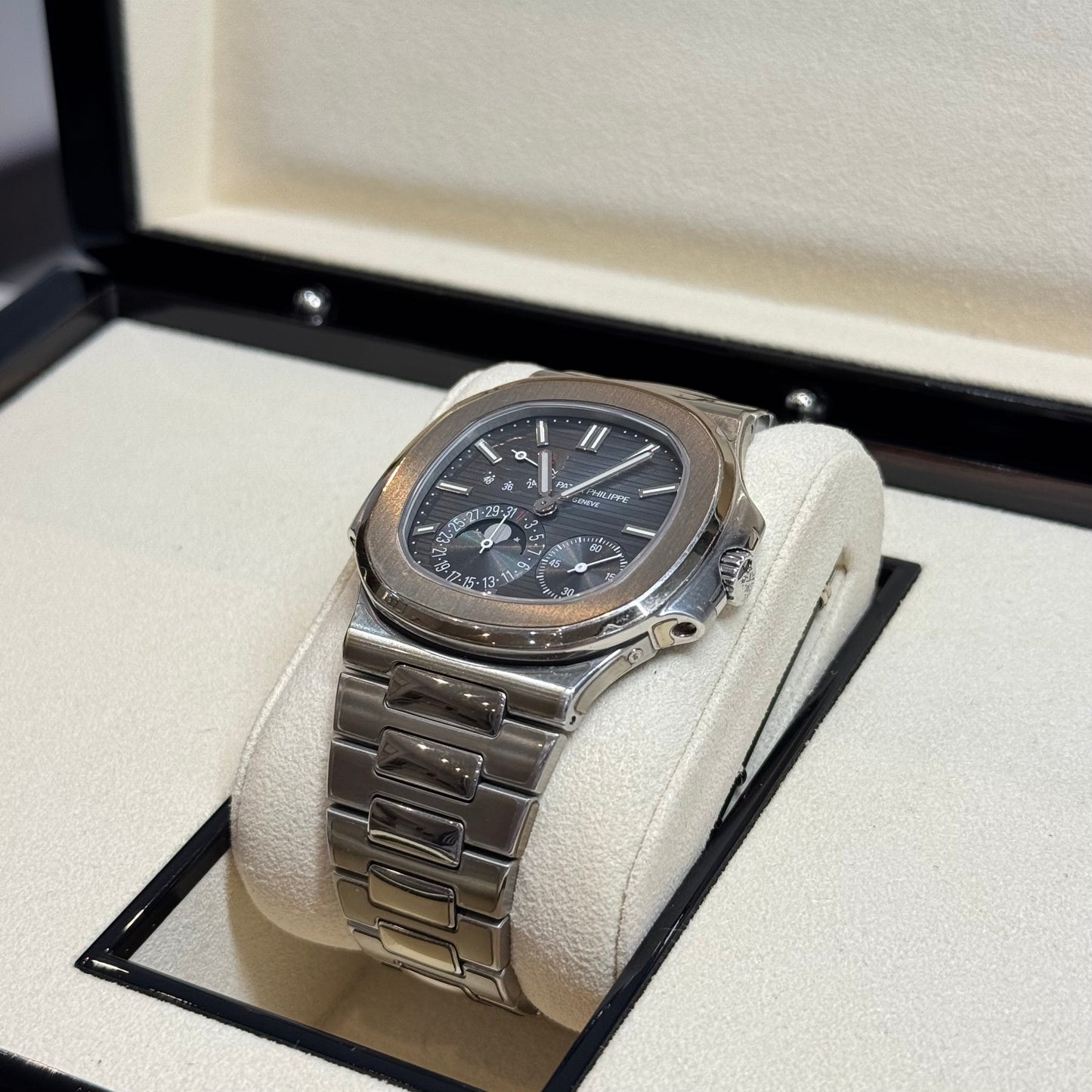 Patek Philippe Nautilus 2017 Ref. 5712/1A-001 - Official Service Papers from 2020 Regal - Hatton Garden Jewellers