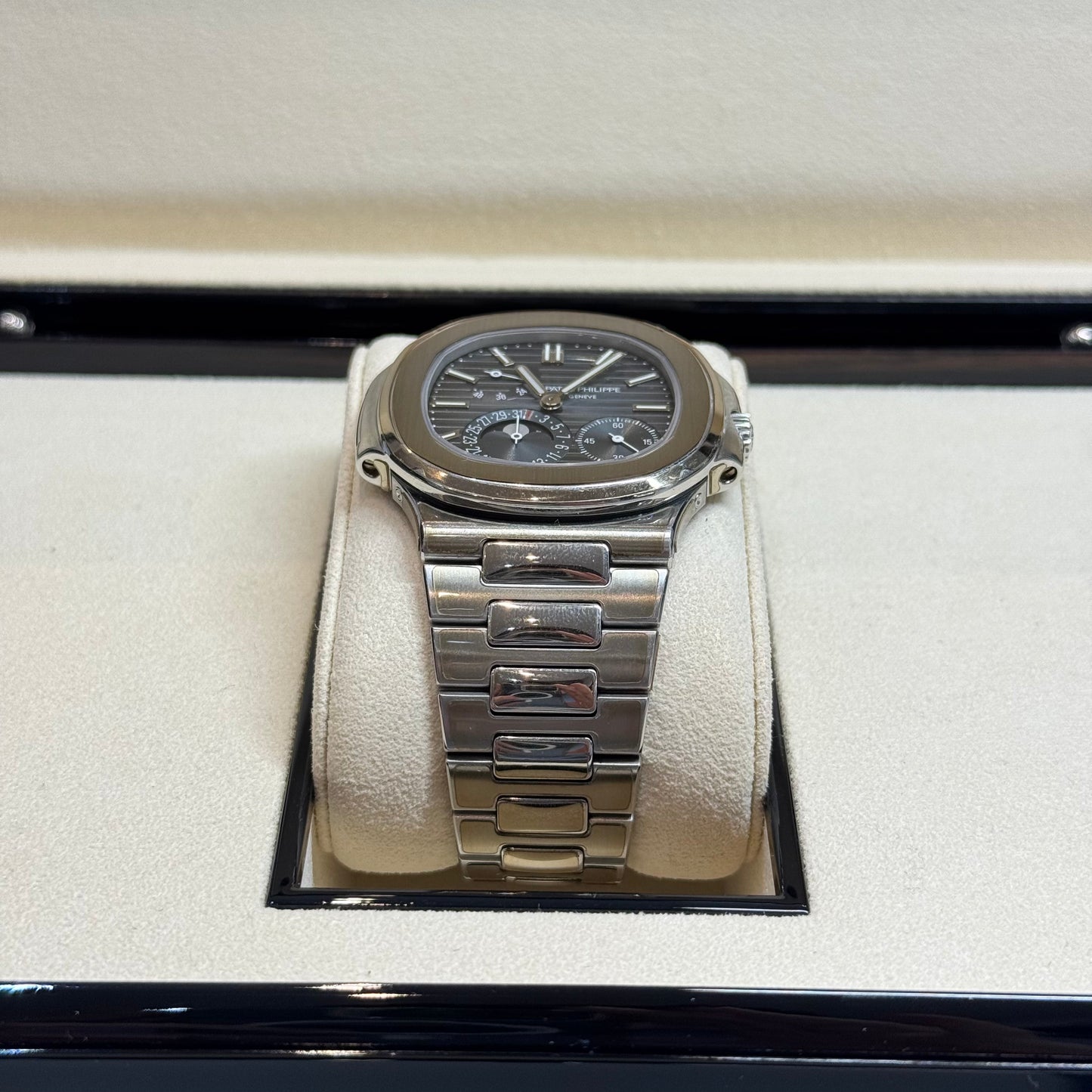 Patek Philippe Nautilus 2017 Ref. 5712/1A-001 - Official Service Papers from 2020 Regal - Hatton Garden Jewellers