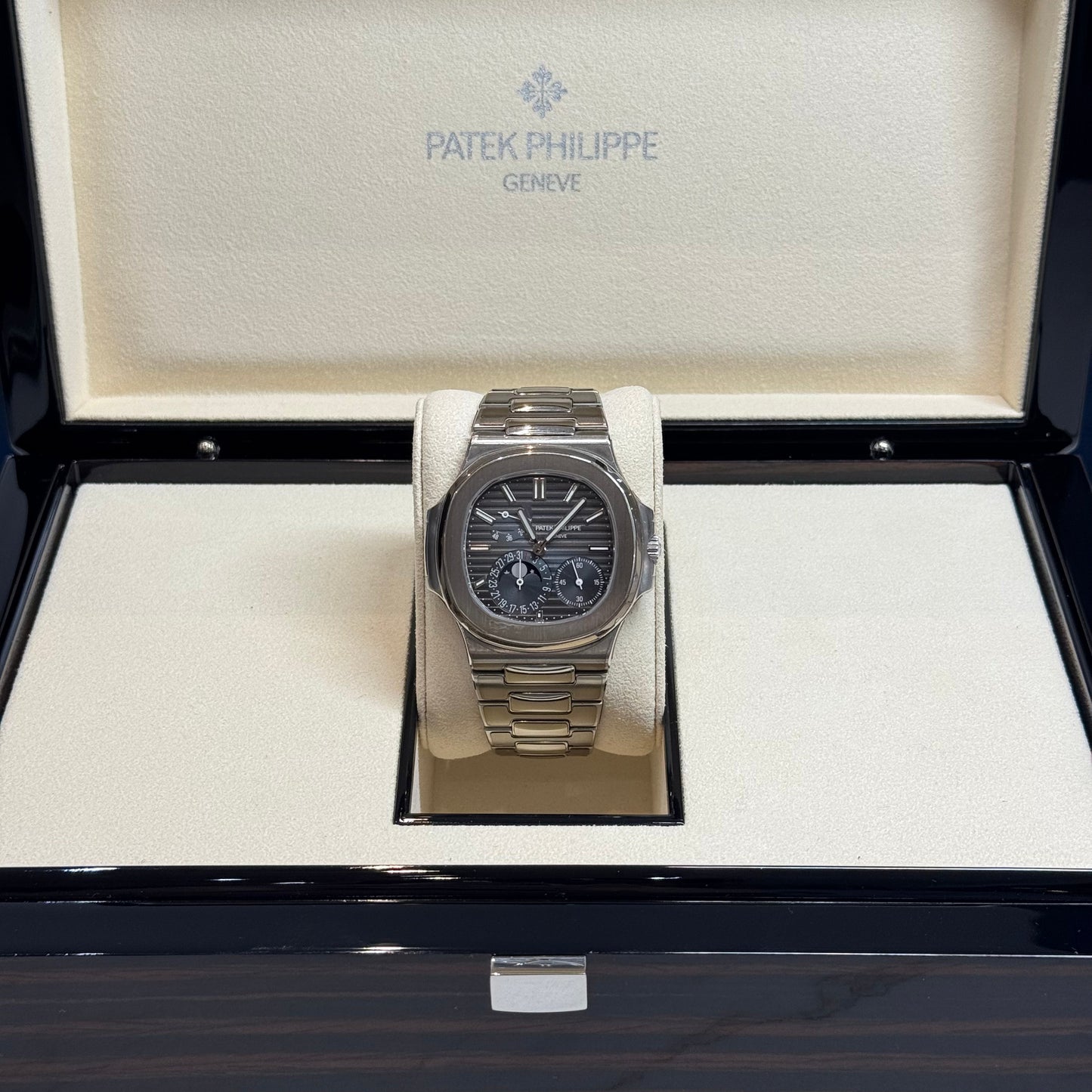 Patek Philippe Nautilus 2017 Ref. 5712/1A-001 - Official Service Papers from 2020 Regal - Hatton Garden Jewellers