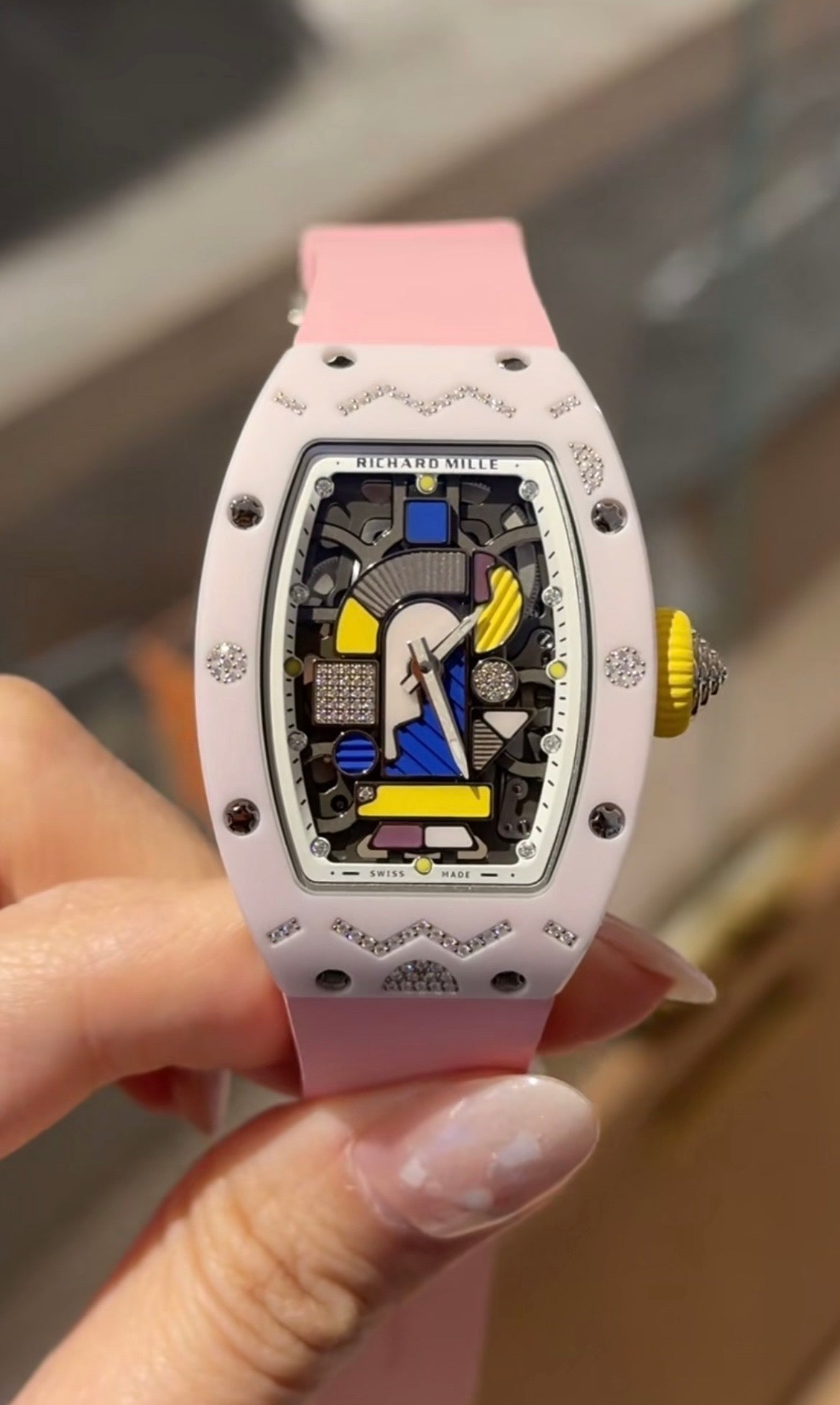 A Richard Millier watch with a light pink rubber strap
